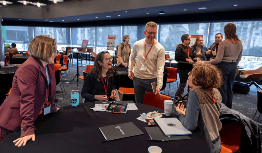 A group of smiling faculty at the CTM launch event, "media in motion," in March 2025.