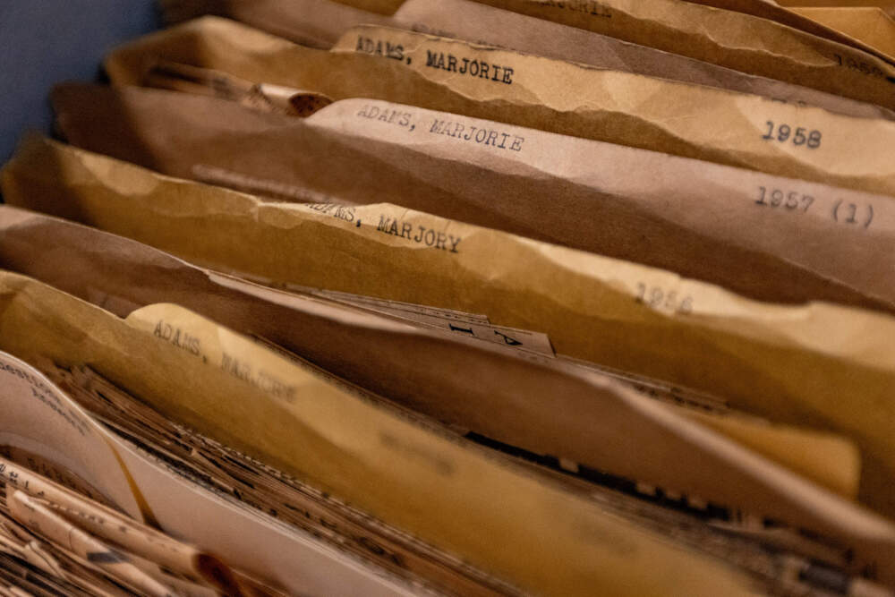 Close-up image depicting folders of articles written by Boston Globe art critic Marjory Adams at the Snell Library at Northeastern University.