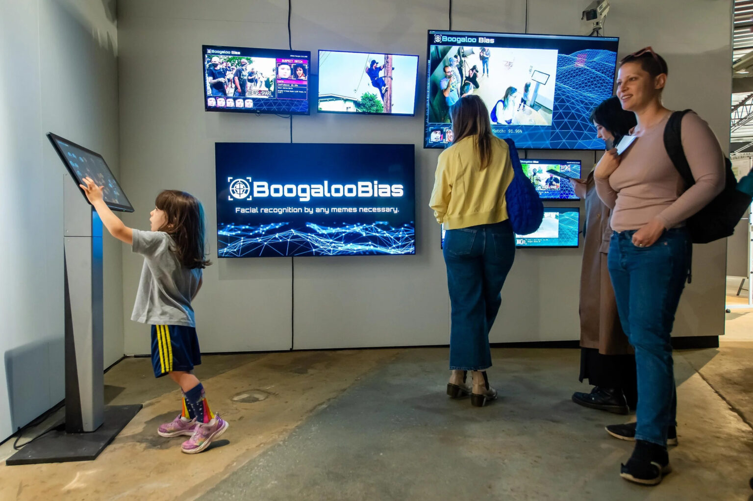 Some visitors interact with Jennifer Gradecki and Derek Curry’s installation Boogaloo Bias during Science Gallery Atlanta’s JUSTICE Community Day in 2023.