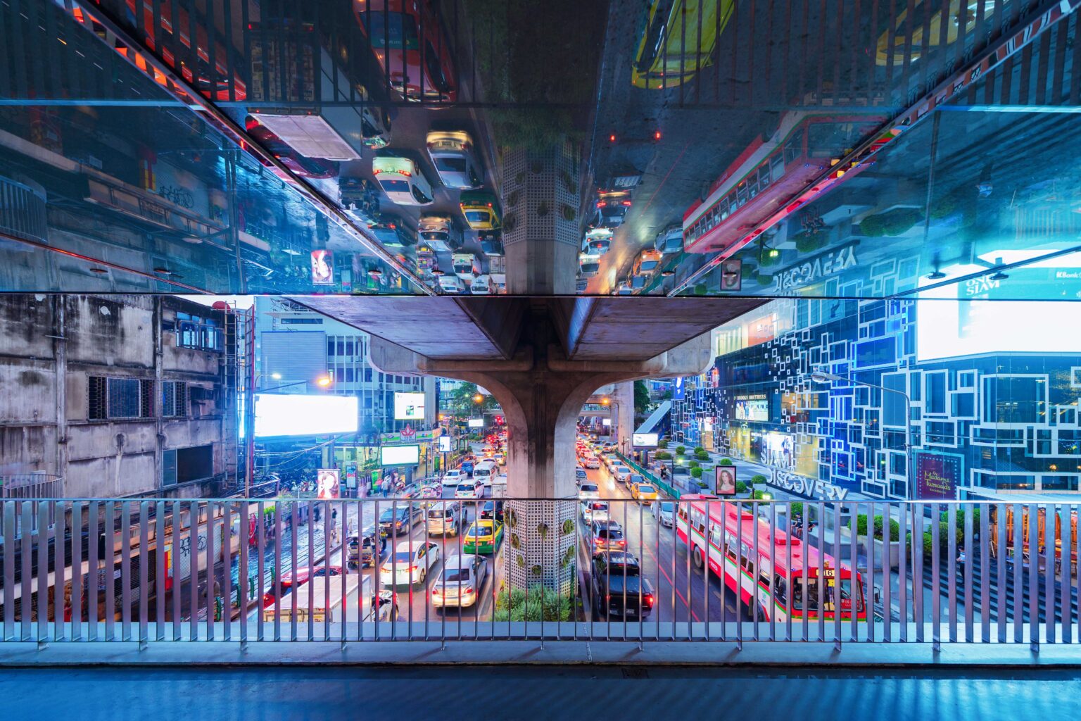 Traffic jam in the rush hour on highway bridge after an event has ended. Busy cars on bridges and roads in Siam Discovery in Bangkok Downtown, Thailand at night.