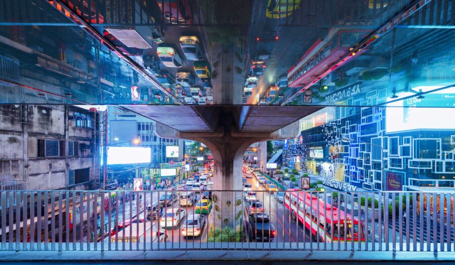 Traffic jam in the rush hour on highway bridge after an event has ended. Busy cars on bridges and roads in Siam Discovery in Bangkok Downtown, Thailand at night.